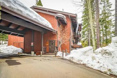 a building with snow in front of it at Master Units 18A & B at Granlibakken in Tahoe City