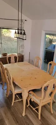 a wooden table with chairs and a dining room at Brummett Lodge Winter Special Ends 51226 in Bass Lake