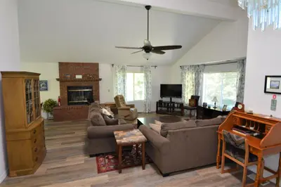 a living room with a couch and a piano at Brummett Lodge Winter Special Ends 51226 in Bass Lake