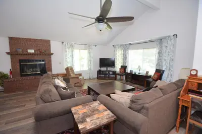 a living room with couches and a fireplace at Brummett Lodge Winter Special Ends 51226 in Bass Lake