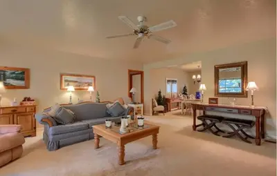 a living room with a couch and a table at Robins Nest- Lake Area Free Night Special in Bass Lake