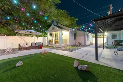 a backyard with a lawn with rocks and lights at Urban Haven in Reno: Charming Studio Retreat in Reno