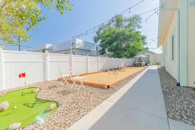 a backyard with a sandbox and a miniature golf course at Reno Oasis: Stylish 1-Bedroom Escape in Reno