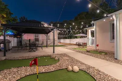 a miniature golf course in a house at night at Reno Oasis: Stylish 1-Bedroom Escape in Reno