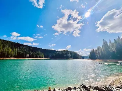 a large body of water with trees in the background at FirePit~Horseshoes~King Bed~Near Lake, Wine, Farms in Pollock Pines