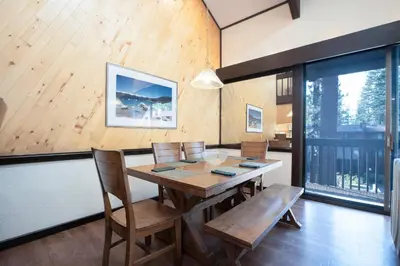 a dining room with a wooden table and chairs at Club Tahoe Resort in Incline Village