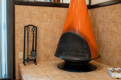 an orange object is sitting on the floor in a bathroom at Club Tahoe Resort in Incline Village