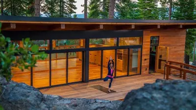 a cabin in the woods with a deck at Modern Ski In-Out Home, Mid-Mountain in Truckee