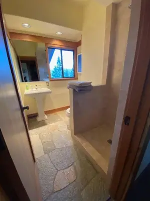 a bathroom with a sink and a toilet and a window at Crystal Bay Lakeview in Crystal Bay