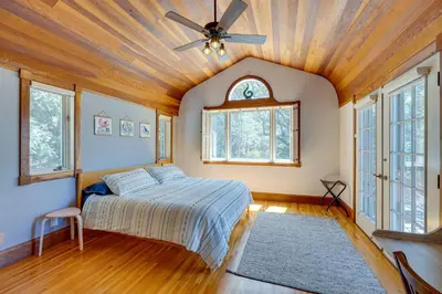 a bedroom with a bed and a ceiling fan at Meadow Vista Mountain Escape with River Views! in Meadow Vista