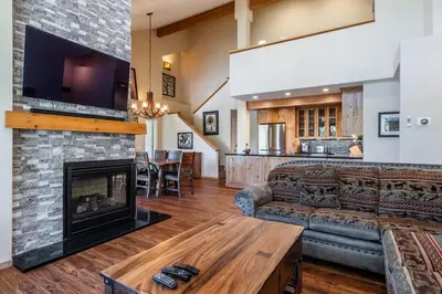 a living room with a couch and a fireplace at Updated 2 Bedroom Plus Loft 3 Bathroom Snowcreek Phase V #860 Sleeps 6 in Mammoth Lakes