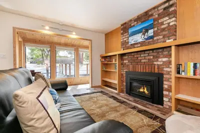 a living room with a couch and a fireplace at Agate Bay 3BDR, Walking Distance to the Beach! in Tahoe Vista