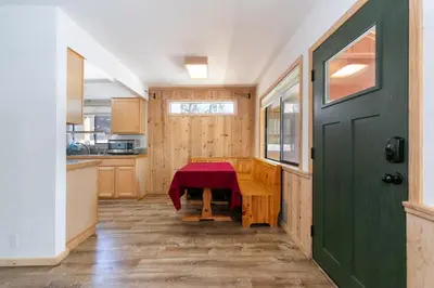 a kitchen with a table and a green door at Agate Bay 3BDR, Walking Distance to the Beach! in Tahoe Vista