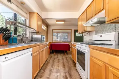 a kitchen with wooden cabinets and white appliances at Agate Bay 3BDR, Walking Distance to the Beach! in Tahoe Vista