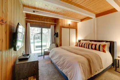 a bedroom with a large bed and a window at Mammoth Lakes Vacation Rental 1 Mi to Ski Area! in Mammoth Lakes