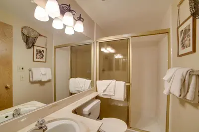 a bathroom with a sink and a shower and a mirror at Mammoth Lakes Vacation Rental 1 Mi to Ski Area! in Mammoth Lakes