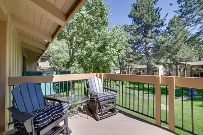 two chairs and a glass table on a porch at Mammoth Lakes Vacation Rental 1 Mi to Ski Area! in Mammoth Lakes