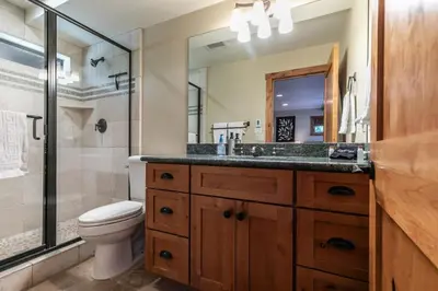 a bathroom with a toilet and a sink and a shower at EJ's Point Walk to Beach in Tahoe City