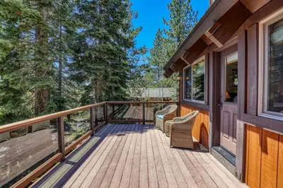 a wooden deck with a bench on a house at EJ's Point Walk to Beach in Tahoe City