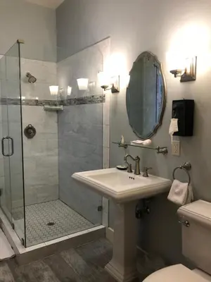 a bathroom with a sink and a shower at Hotel Sutter in Sutter Creek