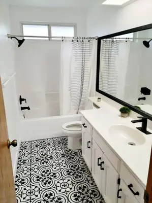 a white bathroom with a toilet and a sink at Oasis Riverfront House -10 min to Sequoia in Three Rivers