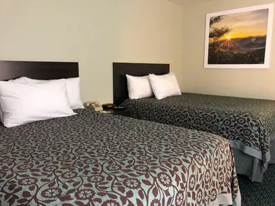 a hotel room with two beds and a picture on the wall at Elevation Lodge in South Lake Tahoe