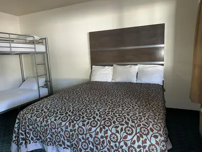 a bedroom with a bed and a bunk bed at Elevation Lodge in South Lake Tahoe