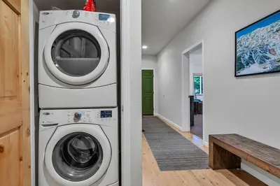 a laundry room with a washer and dryer in a house at 2BDR Condo - Three Minutes to Olympic Valley! in Tahoe City