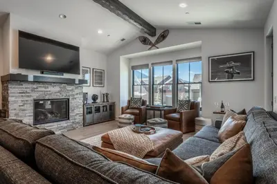a living room with a couch and a fireplace at Creekhouse 1342 in Mammoth Lakes