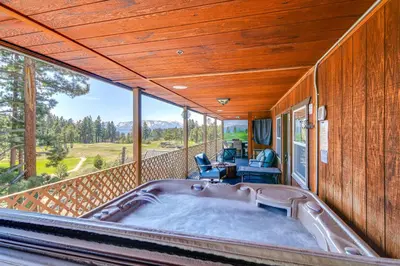 a hot tub on the balcony of a house at Game Room, Mtn Views! Unit 1 Mi to Heavenly Resort in Stateline