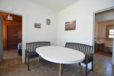 a white table and two chairs in a room at Dupzyk Lake Front Reduced Nightly Rate in Bass Lake