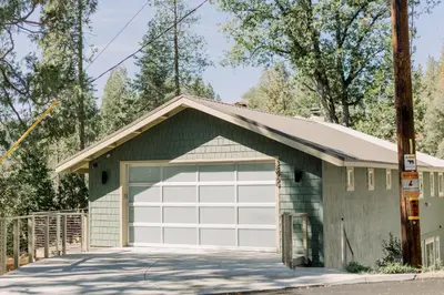 a garage with a white garage door at Werner Lake Front in Bass Lake