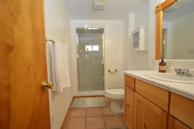 a bathroom with a toilet and a sink and a shower at O'Hara Lake View in Bass Lake