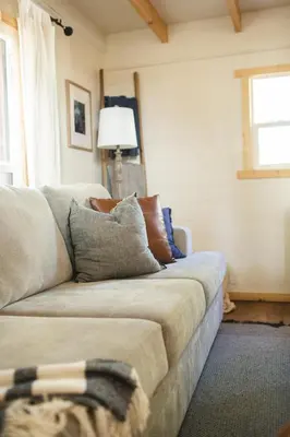 a living room with a couch and a window at Sequoia Glen in Wilsonia