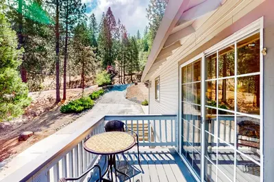 a balcony with a table and a view of a road at The Lake Haus in Groveland