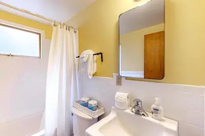 a bathroom with a sink and a mirror at Pine Knolls in Tahoma