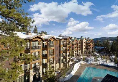 an apartment building with a swimming pool and a resort at Hyatt Vacation Club at Northstar Lodge in Truckee