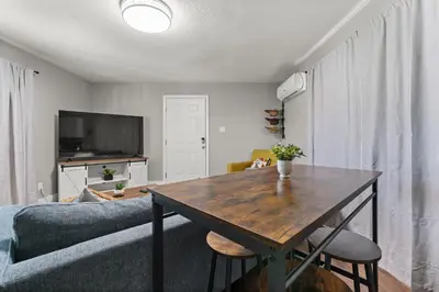 a living room with a table and a couch at Tranquil Retreat: Cozy 2Bed, 1Bath Oasis in Fallon in Fallon
