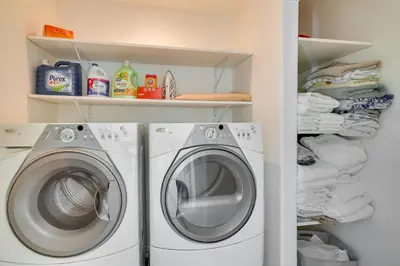 a laundry room with a washing machine and towels at Discovery Bay Home with On-Site Delta Access! in Discovery Bay