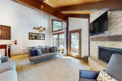 a living room with a couch and a fireplace at Pine Haven Retreat in Stateline