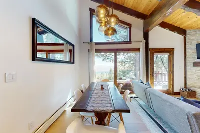 a dining room with a table and chairs at Pine Haven Retreat in Stateline
