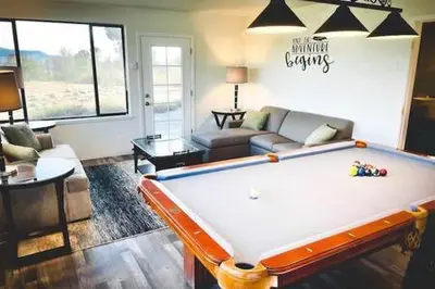 a living room with a pool table in it at Deer Suite HOT TUB GAME ROOM SLEEPS 2 in Ahwahnee