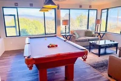 a living room with a pool table in it at Deer Suite HOT TUB GAME ROOM SLEEPS 2 in Ahwahnee