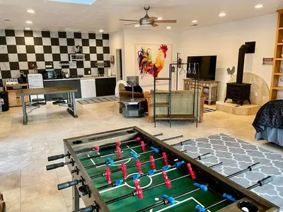 a room with a pool table in the middle of a living room at The Funky Chicken Hot Tub BBQ SLEEPS 4 in Ahwahnee