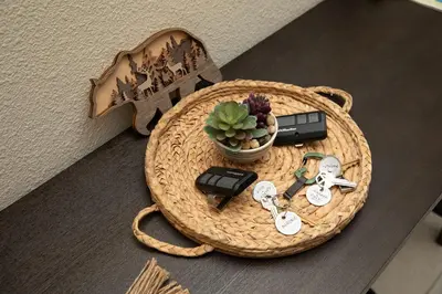 a basket with keys and a plant and a guitar at Modern 5 bed near hospitals and UC Merced in Merced