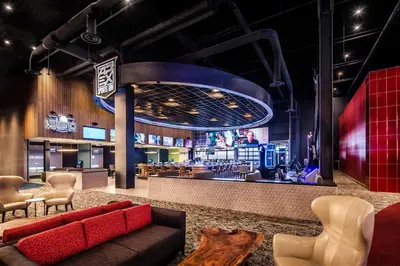 a lobby with a couch and a bar at Red Hawk Resort & Casino in Placerville