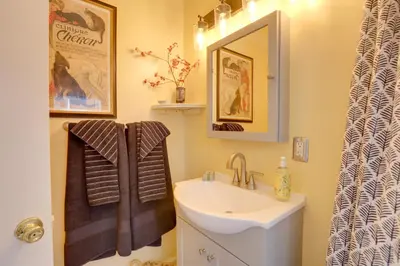 a bathroom with a sink and a mirror at Hot Tub and Grill Pet-Friendly Apt, Walk to Midtown in Reno