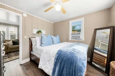 a bedroom with a bed and a ceiling fan at Cozy 1bdr/1br home near downtown in Sacramento