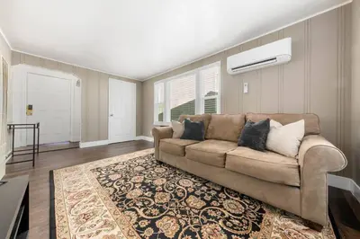 a living room with a couch and a rug at Cozy 1bdr/1br home near downtown in Sacramento