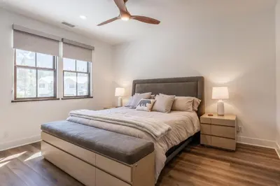 a bedroom with a large bed with a ceiling fan at Creekhouse 1583 in Mammoth Lakes